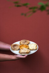 hand with variant cinnamon roll