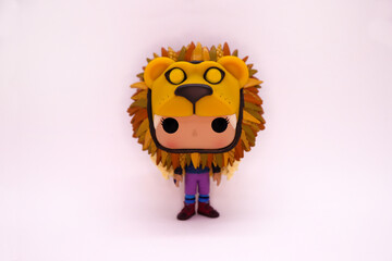 Fototapeta premium Funko Pop Luna Lovegood with lion costume. Harry Potter character. collectible toy Collection doll. Ravenclaw house student. White background. Isolated. The Quibbler Magazine.