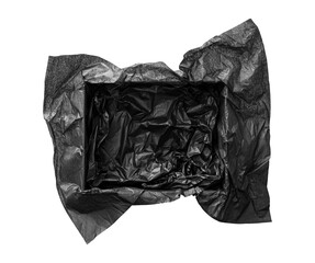Top view of empty open gift box with black color silk paper filling inside. Luxury present wrapping...