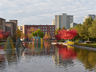 City European public park with fountains in the Finnish town of Kerava: reflections of clouds, city...