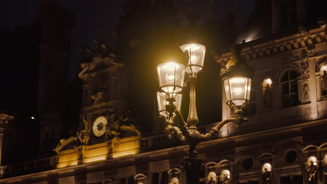 Lantern on the background of a historic building with the French flag