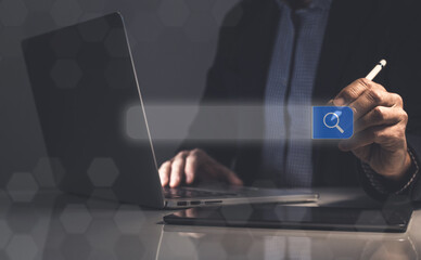 Businessman use laptop for searching online. Search engine bar. Browsing Internet concept.