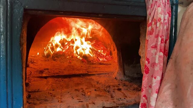 cooking on the fire of a home rustic oven chowder soup in a pot.