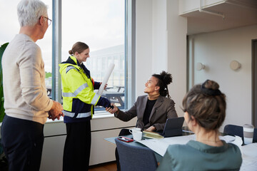 Architects having meeting in office