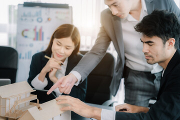 businessteam hand working and laptop with on architectural project in office.