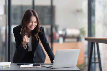 Happy excited successful businesswoman celebrete in office room..