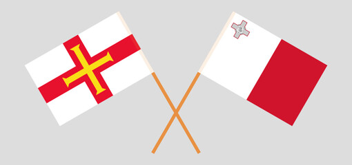 Crossed flags of Bailiwick of Guernsey and Malta. Official colors. Correct proportion