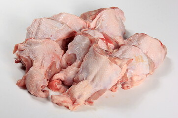 Fresh chicken skeletons on a white background. Raw chicken backs skin on bone. Fresh Chicken Back