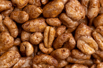 Grain wheat covered with a thin layer of chocolate