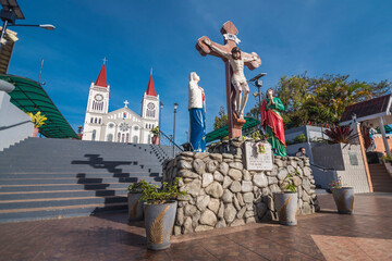 Baguio City, Philippines - A cross and steps in front of Our Lady of the Atonement Cathedral or Baguio Cathedral. Part of the Archdiocese of Nueva Segovia - obrazy, fototapety, plakaty