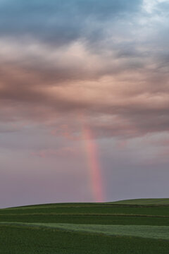 Morning Rainbow and Storm Clouds