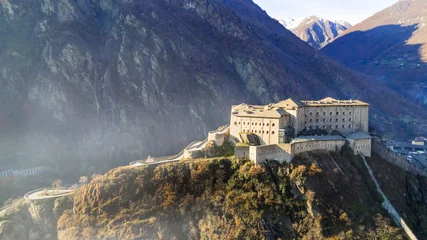 Poster Italy .Famous medieval castles of valle d'Aosta - impressive Bard fort. aerial drone view © Freesurf