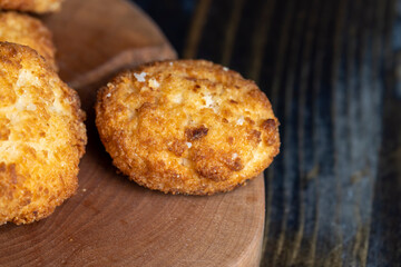 Delicious cookies with coconut on the table