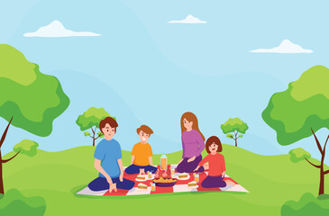 Father,Mother,daughter and son sitting on mat together,in a park,picnic time,