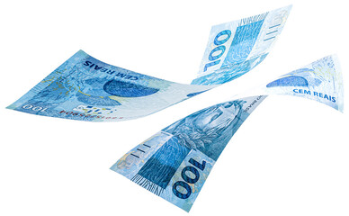 banknotes of one hundred reais from brazil falling on isolated white background. Fall of the...