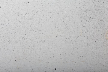 White painted wooden background with black spraying, texture, abstract backdrop, copy space