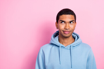 Portrait of minded creative cool person look interested empty space isolated on pink color...