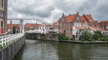 View of the historic harbor with its characteristic houses of Enkhuizen, the Netherlands.