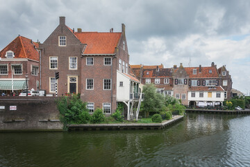 Fototapeta premium View of the historic harbor with its characteristic houses of Enkhuizen, the Netherlands.