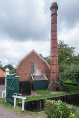 This image shows an old laundry that was powered by steam power, which can be found in the Zuiderzee Museum in Enkhuizen. - 564677028
