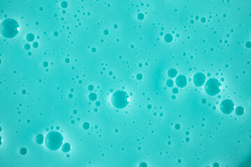 Bubble mint turquoise background texture. Berry gel to cleanse the skin of the face and body. Spa...