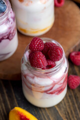 yogurt with fresh berries and raspberry jam