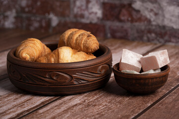 Croissants and Turkish delight on the table in the kitchen 
