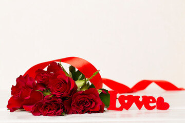 Valentines day red roses with decor on white table