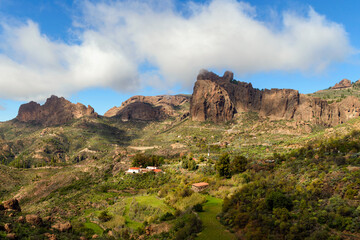 Fototapeta na wymiar A beautiful view of the rocky landscape and the little mountain houses at Nublo Rock Rural Park, Gran Canary, Canary Islands, Spain