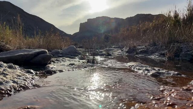 Stream of water on the bottom of canyon at Tabernas Desert, Andalusia, Spain,