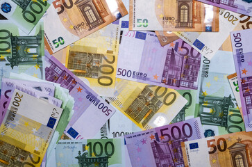 Euro banknotes in the assortment. View from above.