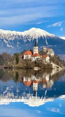 Fototapeta premium Lake Bled Slovenia (Blejsko jezero). Beautiful mountain lake with small Pilgrimage Church. 