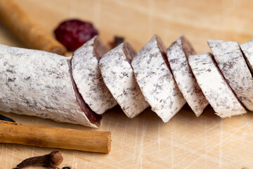 Chunks of sliced sausage with white mold