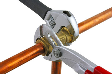 Plumbing wrenches adjusting fitting on pipework. transparent png.