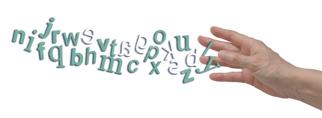 Chaotic jumbled complete alphabet with reversed letters depicting dyslexia flowing into open hand...