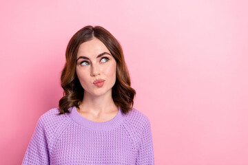 Photo of dreamy pretty lady wear stylish purple comfort sweater look empty space want buy new collection isolated on pink color background