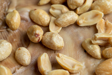 Peeled and roasted peanuts on the table
