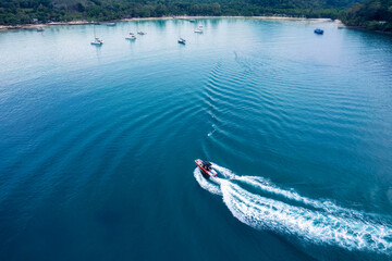 Fototapeta premium Speedboat sailing and rippled on tropical sea in summer vacation
