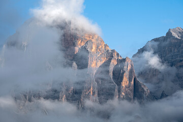 Mountains landscape with fog in italian alps