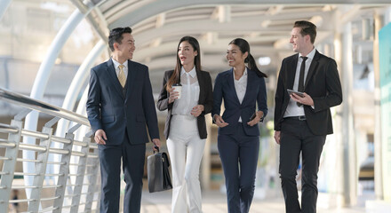 Fototapeta premium Business people walking and talk to each other in front of modern office