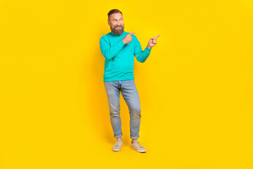 Full size photo of handsome granddad fingers point empty space interested wear trendy aquamarine outfit isolated on yellow color background