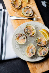 Oysters and clams. Little Neck Clams. Fresh clams served with garlic, shallots, cocktail sauce, mignonette sauce and fresh lemons and limes. Classic American steakhouse or French bistro appetizer.