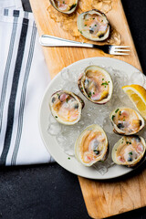 Oysters and clams. Little Neck Clams. Fresh clams served with garlic, shallots, cocktail sauce, mignonette sauce and fresh lemons and limes. Classic American steakhouse or French bistro appetizer.