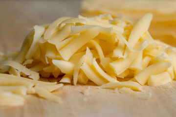 Sliced and grated hard cheese with cashew nuts