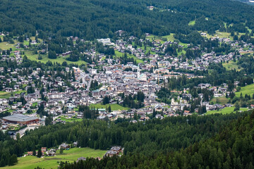 Fototapeta na wymiar The town of Cortina d'Ampezzo seen from a nearby peak