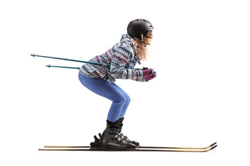 Full length profile shot of a woman skiing