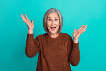 Photo of overjoyed cheerful lady wear stylish clothes raise hands impressed unexpected meeting...
