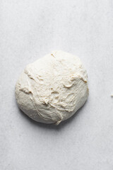Bread dough resting on a marble surface, Bread dough that has doubled in size, dough that has risen, proofed dough