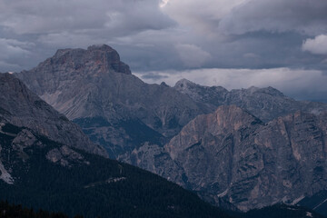 Dolomite mountain Croda Rossa under a cloudy sky at dusk