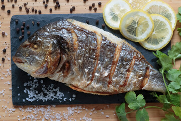 Grilled dorado, tasty and juicy fish ready to eat close-up